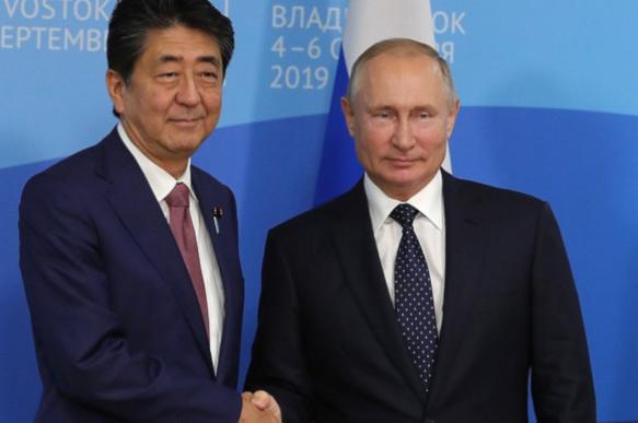 Japan's Shinzo Abe to Putin: Let's conclude peace treaty. 63836.jpeg