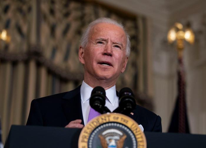 Why does Joe Biden joke about evacuation from Afghanistan?