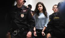 Russian men and women support teen sisters, who killed their father