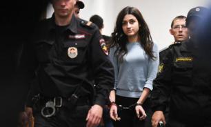 Russian men and women support teen sisters, who killed their father